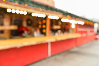 Blurred view of Christmas fair stalls outdoors