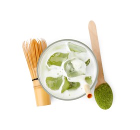 Glass of tasty iced matcha latte, bamboo whisk, spoon and powder isolated on white, top view