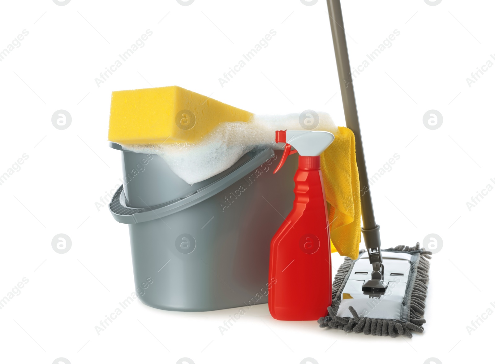 Photo of Plastic bucket with foam and cleaning supplies on white background