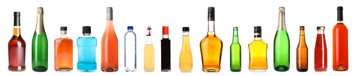 Set of bottles with different liquids on white background. Banner design