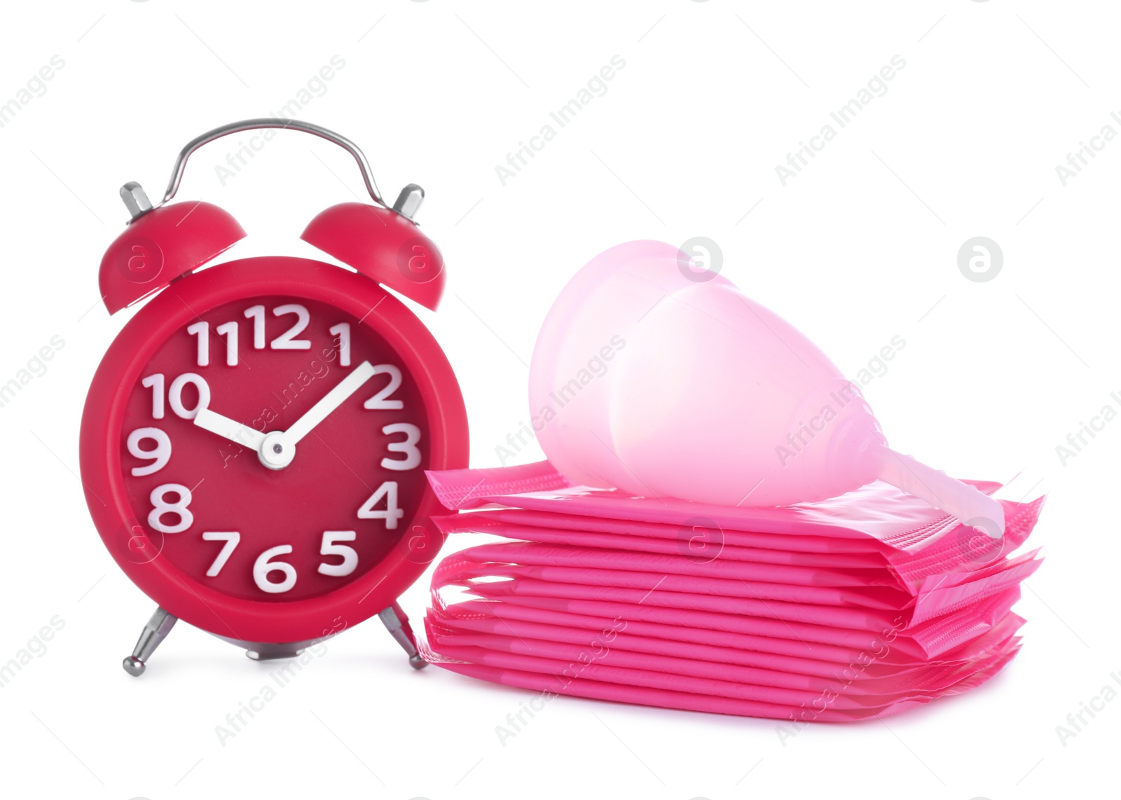 Photo of Clock, menstrual pads and cup on white background. Gynecology concept