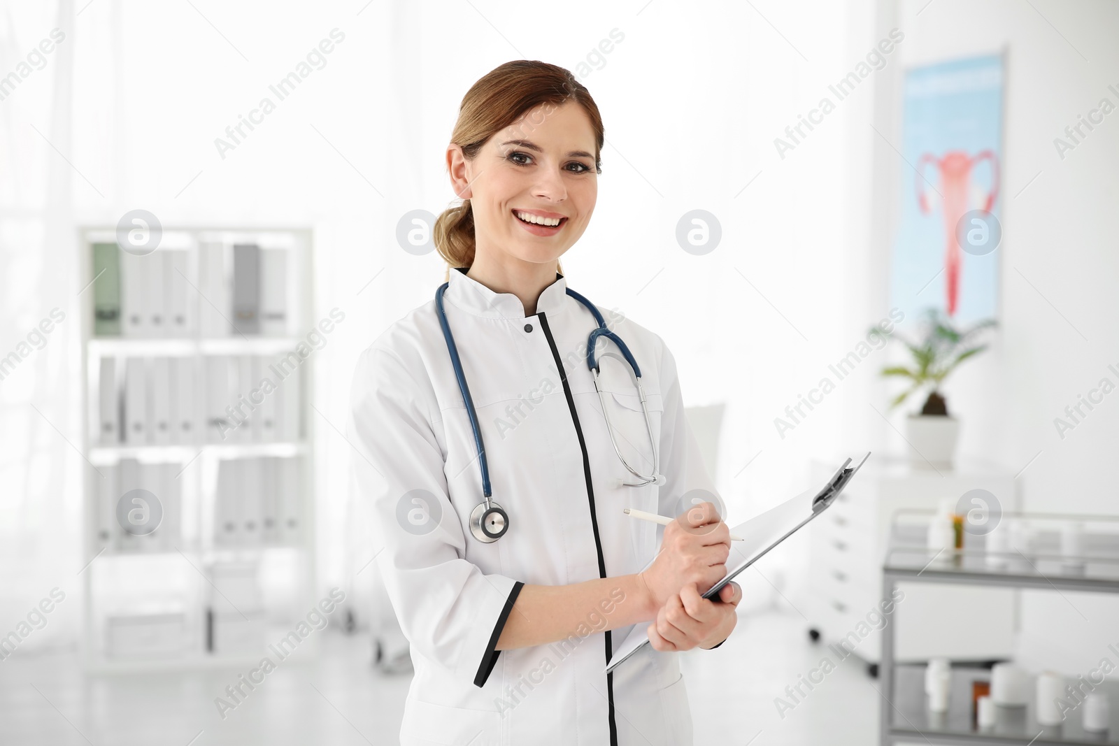Photo of Female doctor with clipboard in hospital. Gynecology consultation