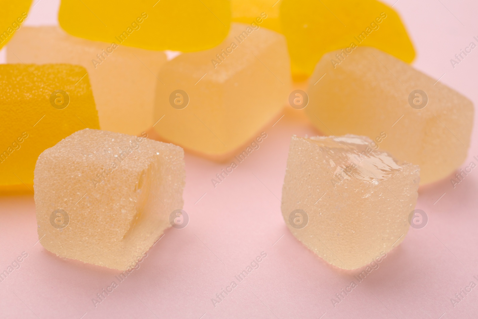 Photo of Tasty fresh jelly candies on color background