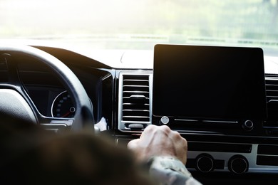 Soldier with tablet in car, closeup view