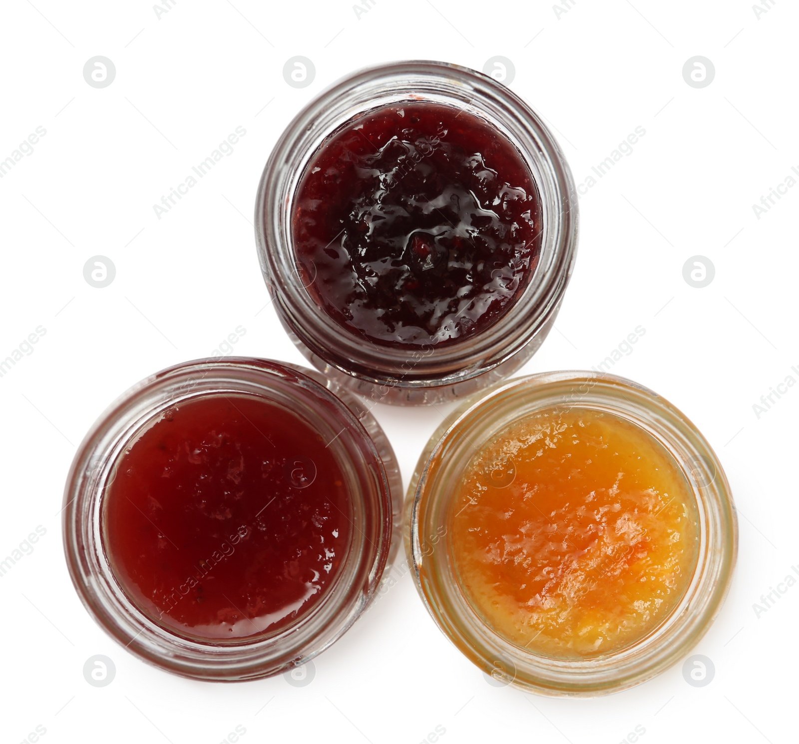 Photo of Jars with different jams on white background, top view