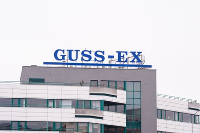 Photo of Warsaw, Poland - September 10, 2022: Building with modern Guss-Ex logo