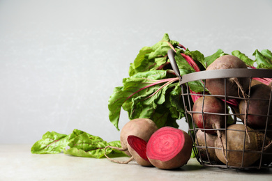 Fresh ripe beets on light grey table