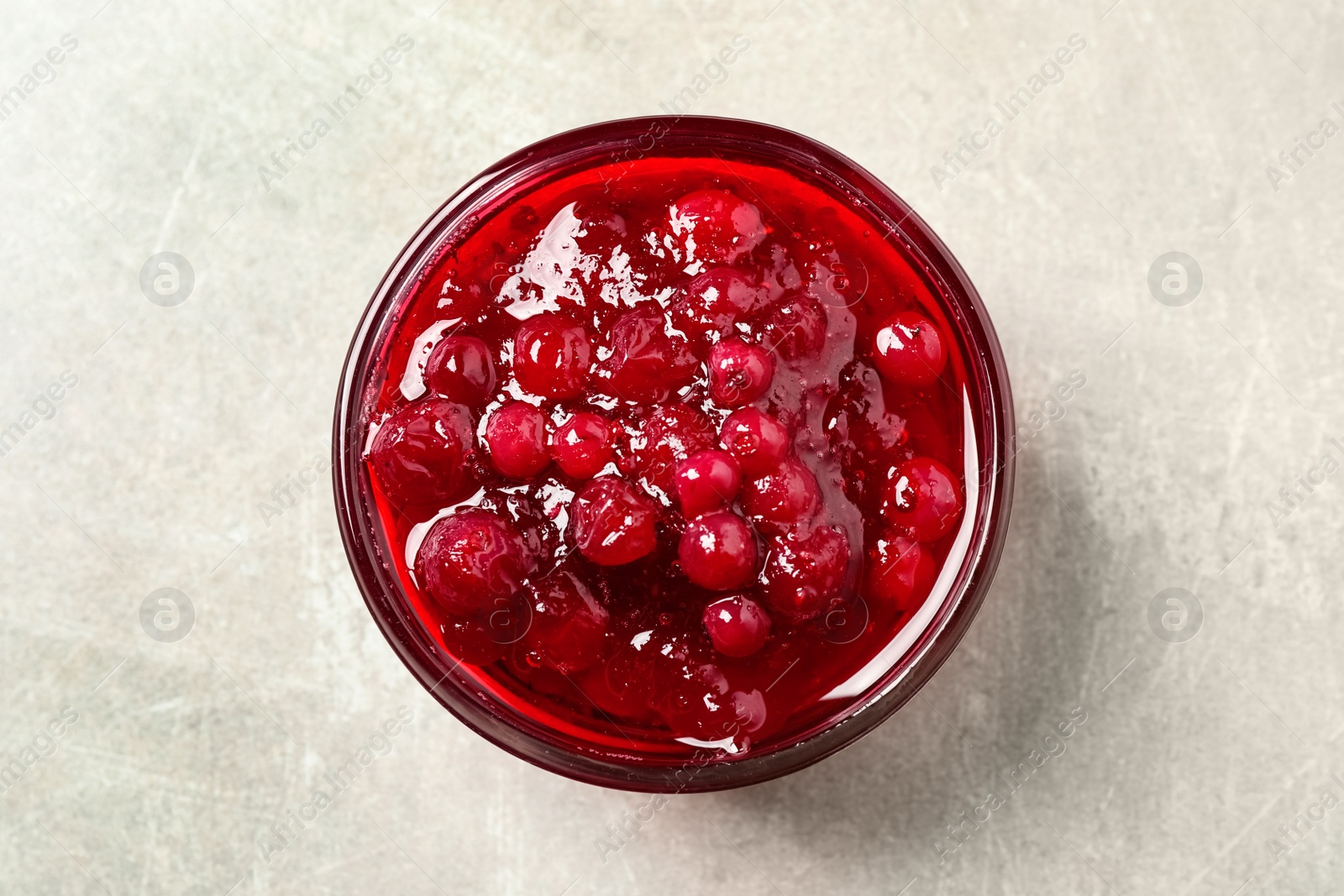 Photo of Cranberry sauce on light table, top view