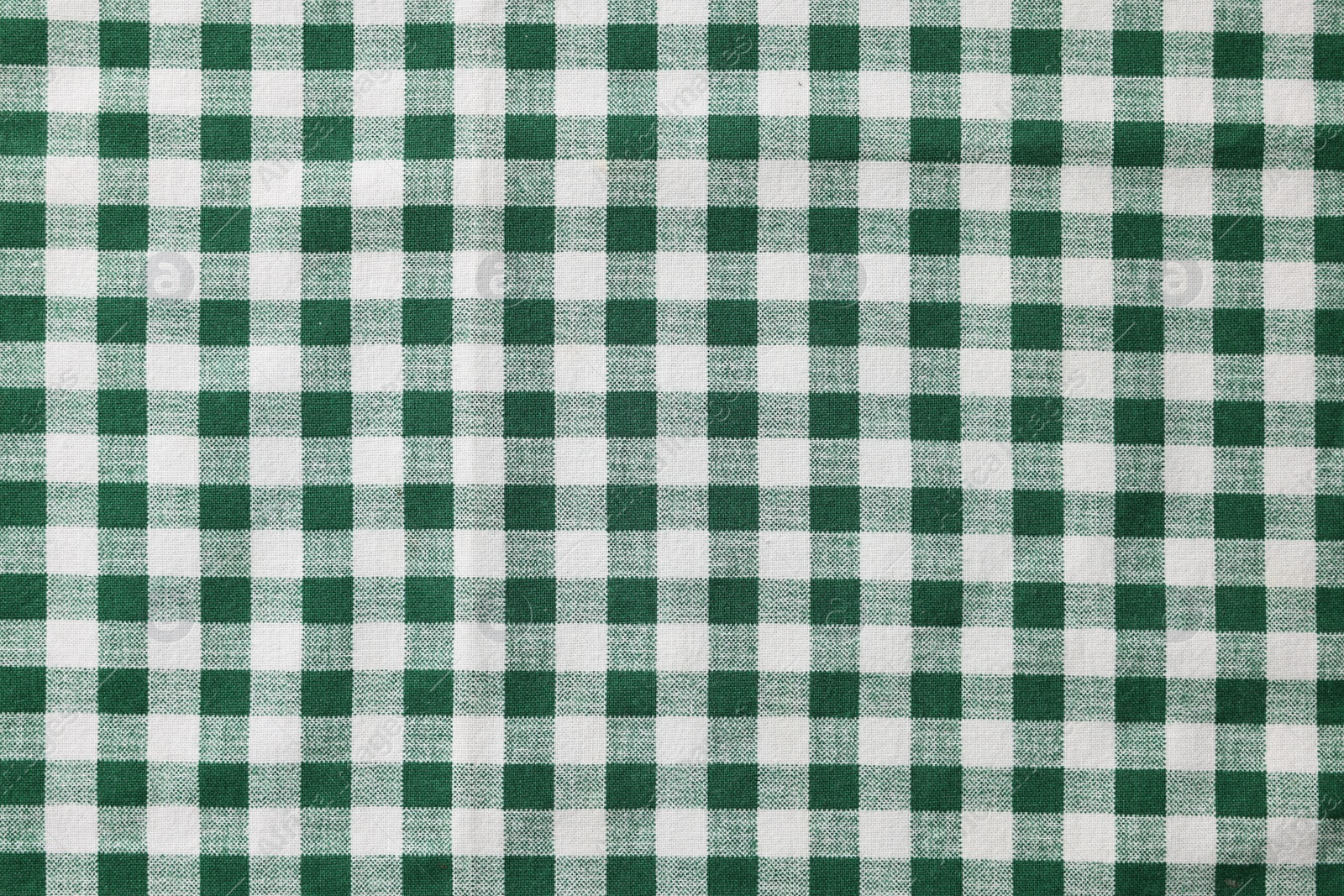 Photo of Green checkered tablecloth as background, top view