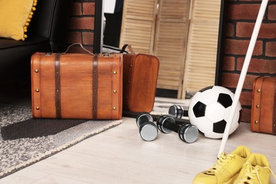 Photo of Mirror, suitcase, ball and dumbbells in stylish teenager's room