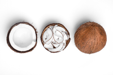 Photo of Composition with fresh coconut flakes on white background, top view