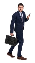 Photo of Handsome bearded businessman in suit with smartphone and briefcase on white background