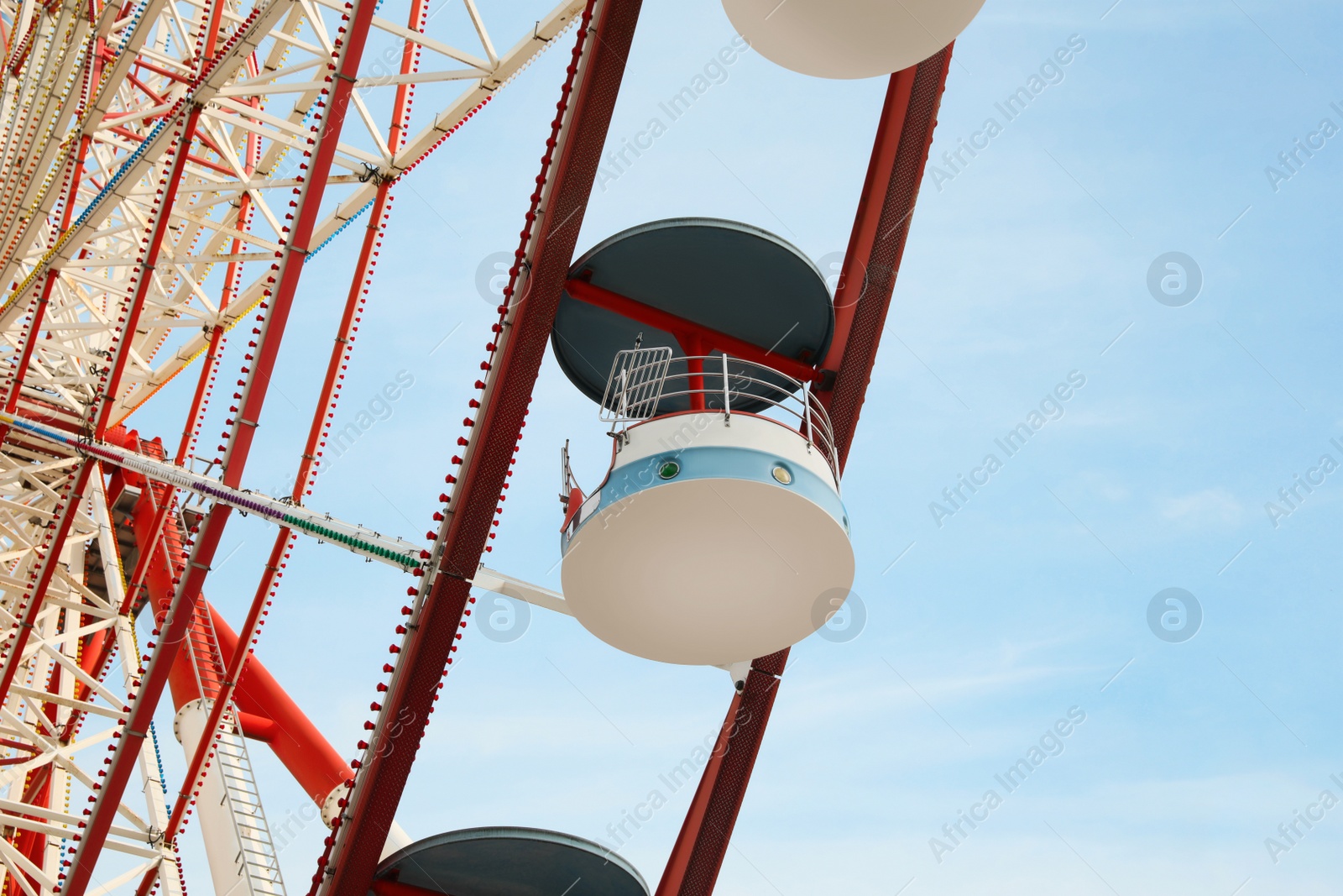 Photo of Beautiful large Ferris wheel outdoors, low angle view