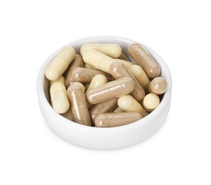 Photo of Vitamin capsules in bowl isolated on white. Health supplement