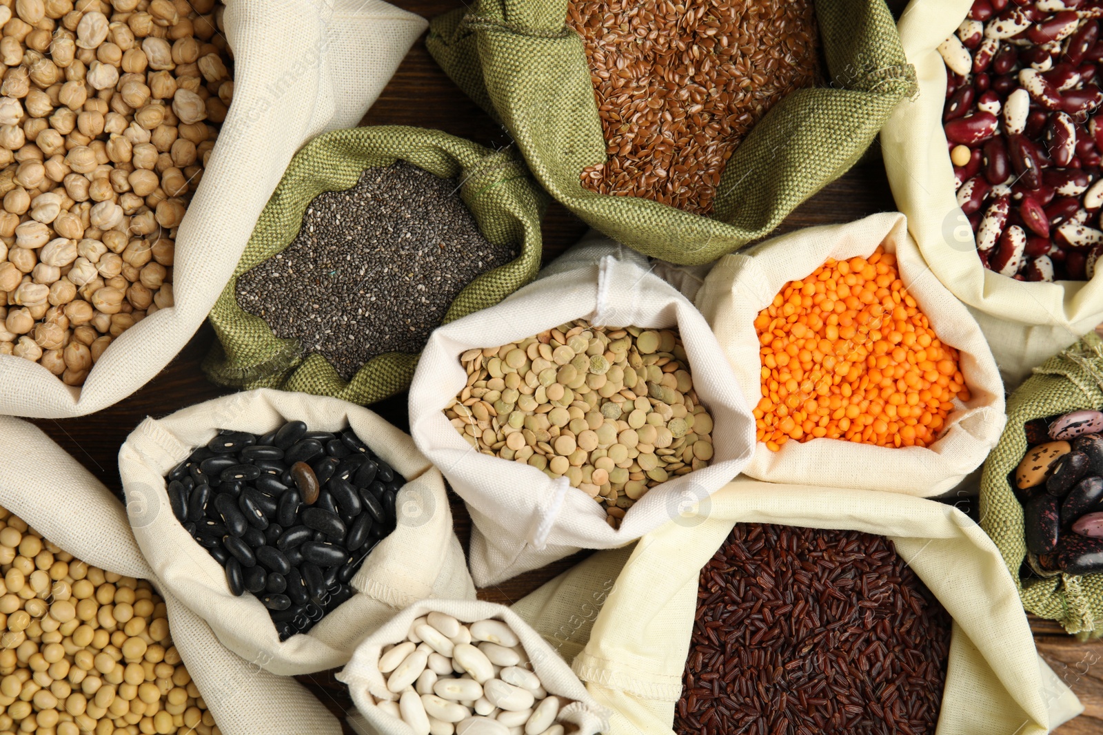 Photo of Different grains and seeds as background, top view. Veggie diet
