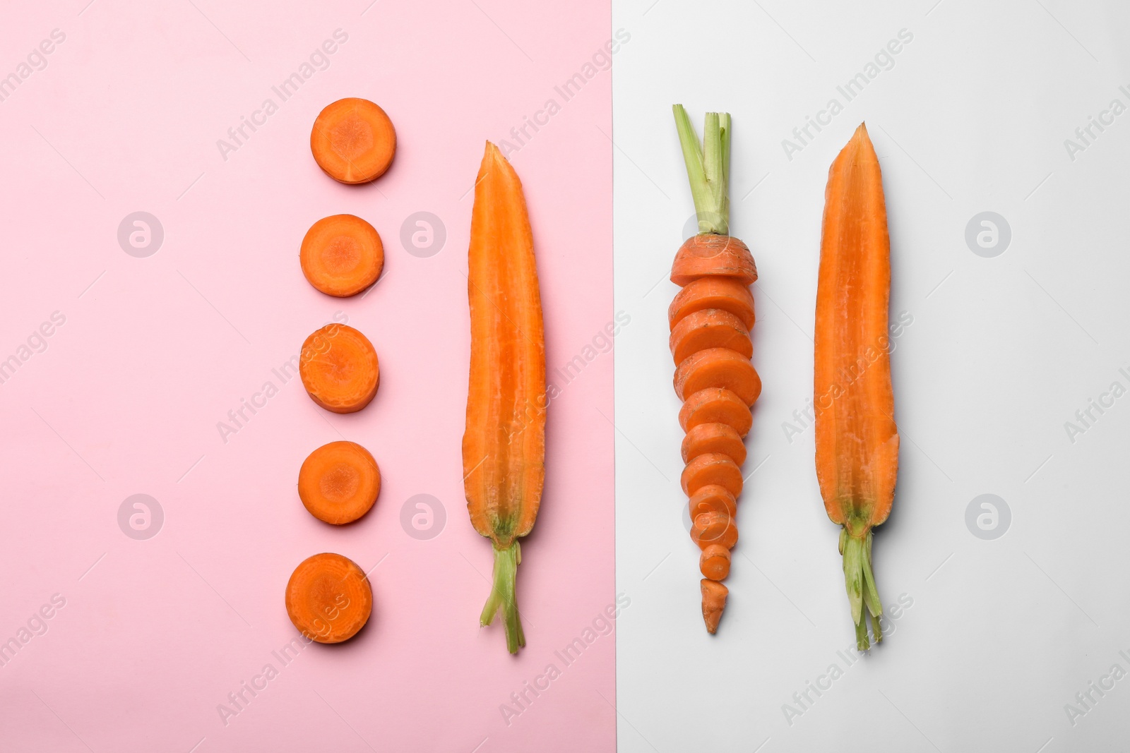 Photo of Flat lay composition with fresh sliced carrots on color background