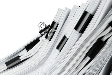 Photo of Pile of documents with binder clips, closeup