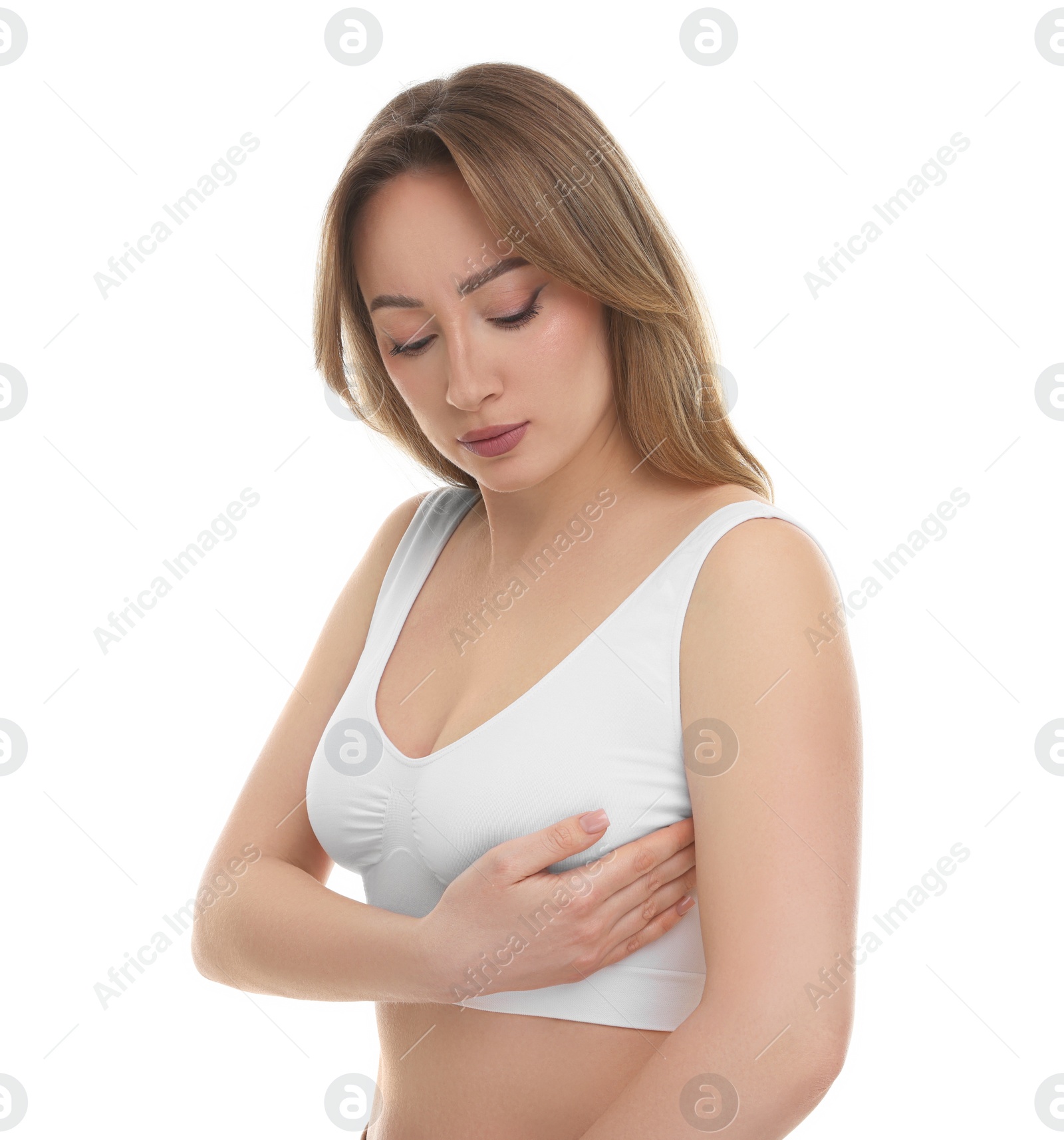 Photo of Mammology. Young woman doing breast self-examination on white background