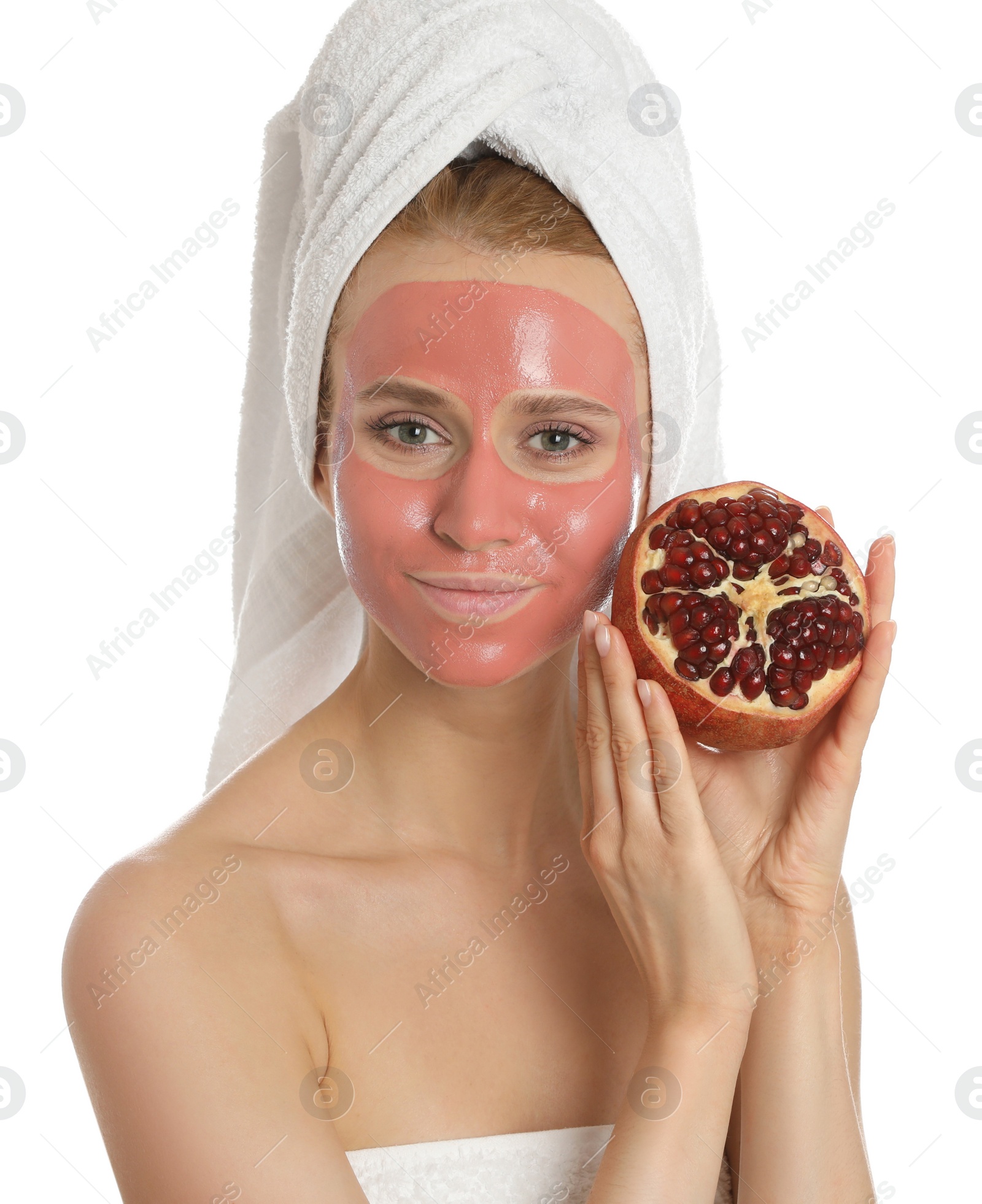 Photo of Young woman with pomegranate face mask and fresh fruit on white background