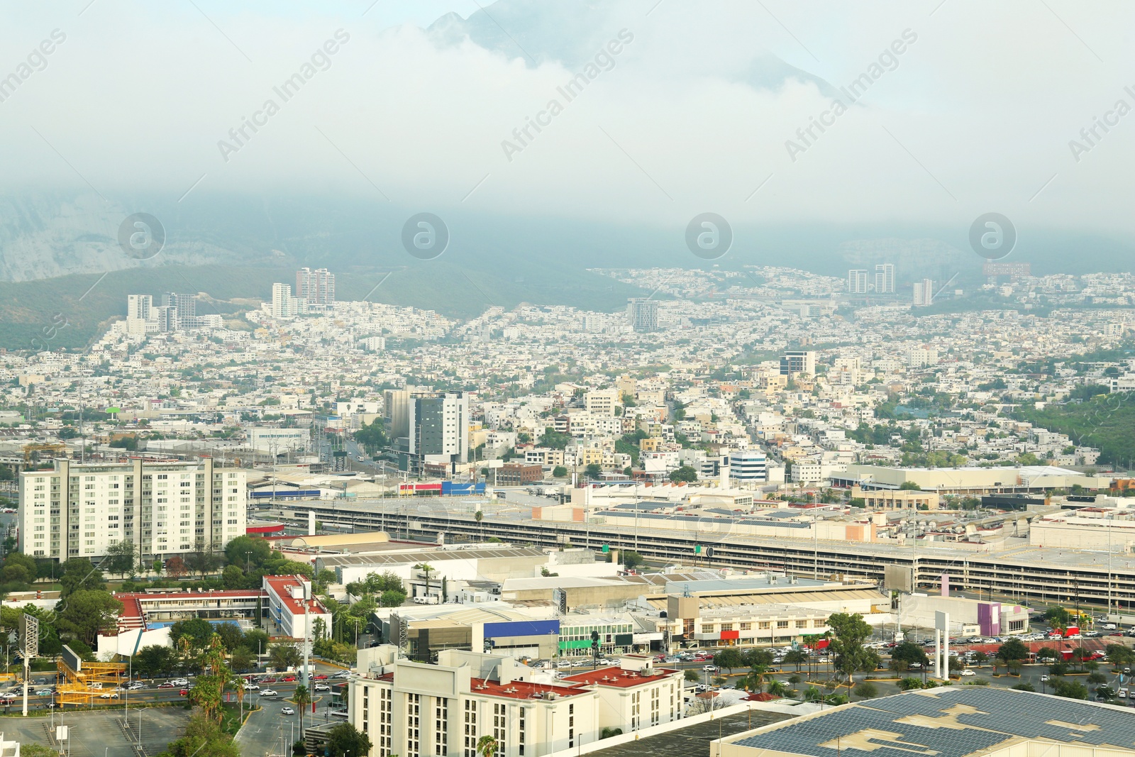 Photo of Picturesque view of beautiful cityscape under fog