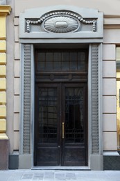 Photo of Entrance of house with beautiful door, elegant moldings and transom window