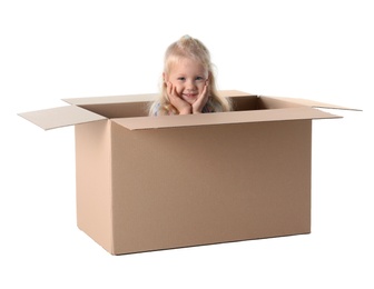 Cute little girl playing with cardboard box on white background