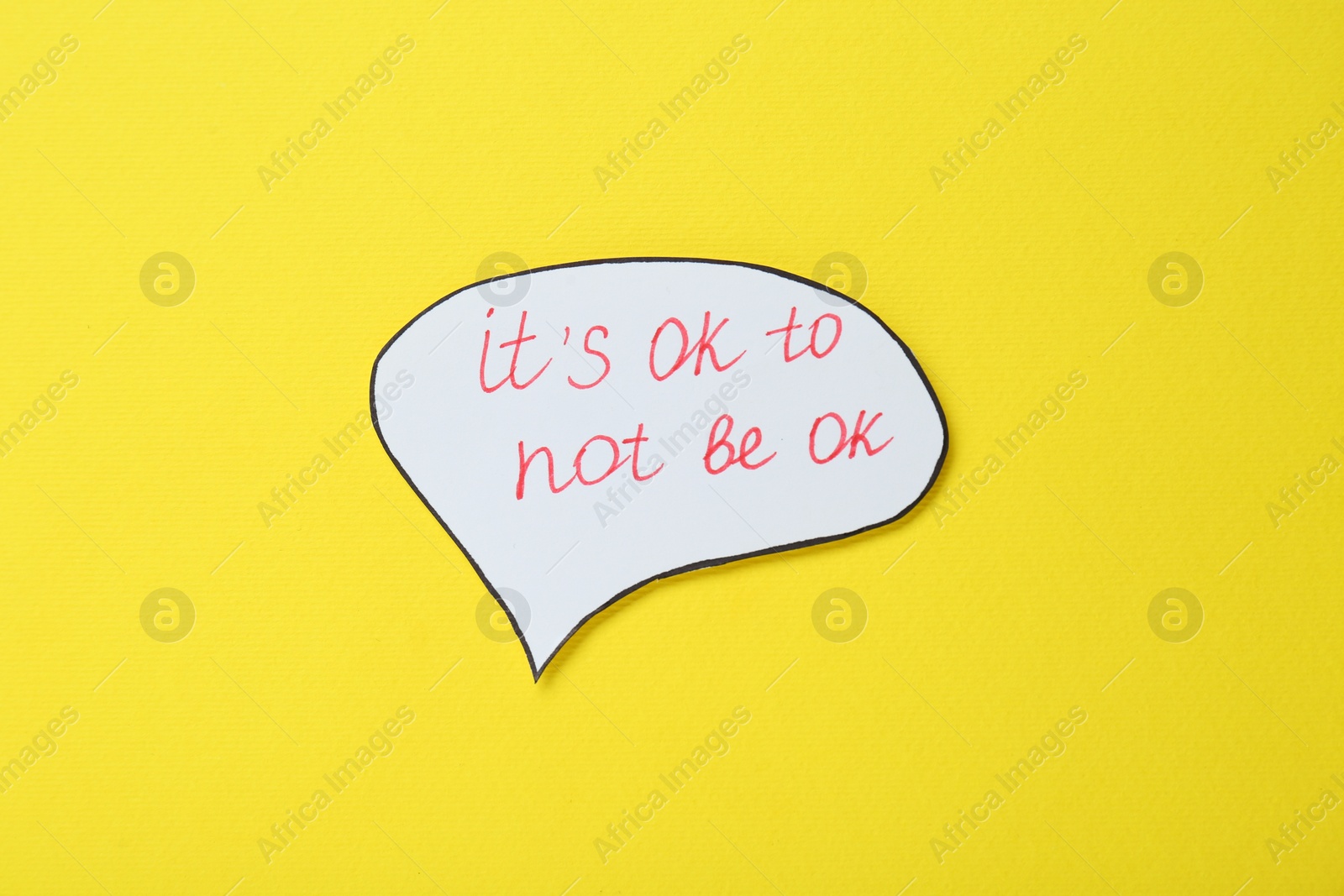 Photo of Card with phrase It`s Ok to Not Be Ok on yellow background, top view