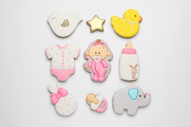 Set of baby shower cookies on light background, flat lay