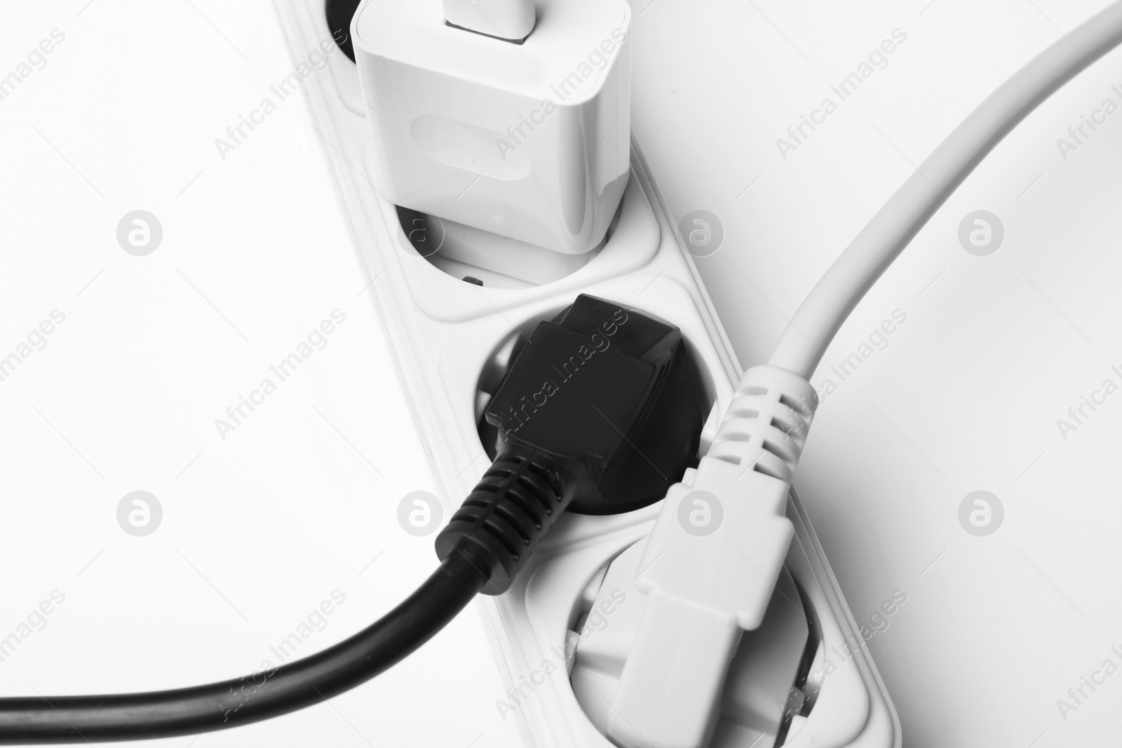 Photo of Extension cord on white background. Electrician's professional equipment