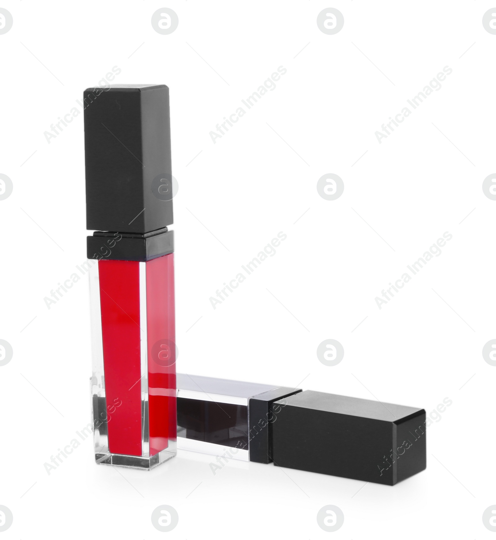 Photo of Two lip glosses isolated on white. Cosmetic products