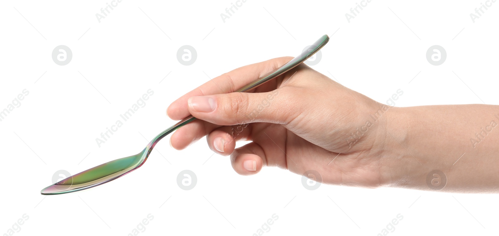 Photo of Woman holding clean tablespoon on white background, closeup