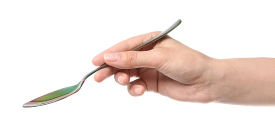 Photo of Woman holding clean tablespoon on white background, closeup