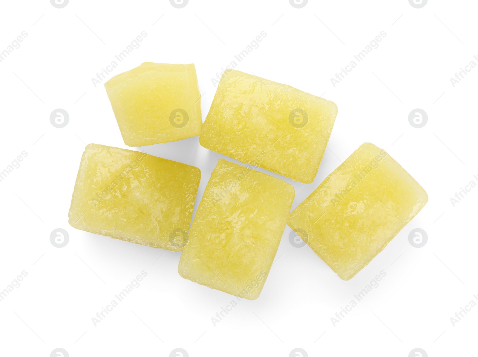 Photo of Frozen zucchini puree cubes isolated on white, top view