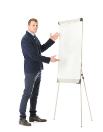 Business trainer giving presentation on flip chart board against white background