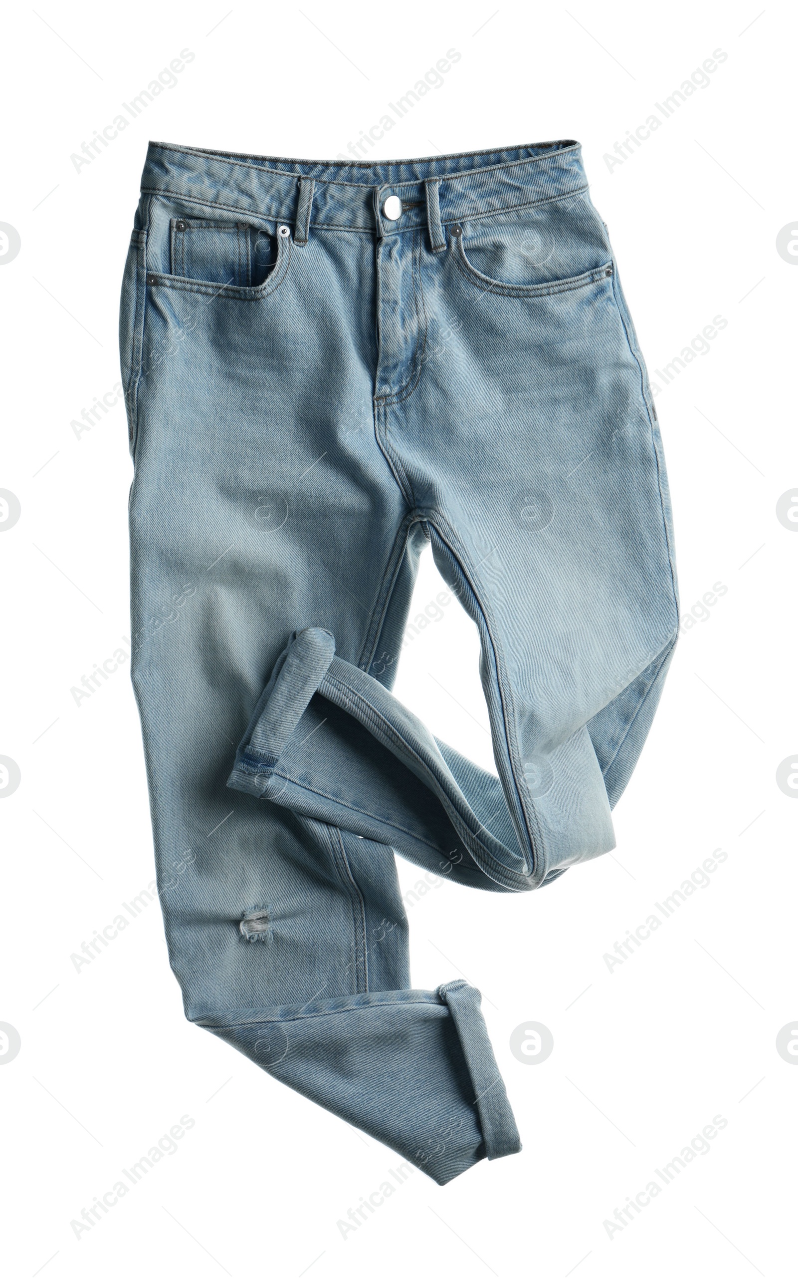 Photo of Rumpled jeans isolated on white. Messy clothes