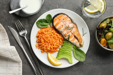 Healthy food high in vegetable fats served on grey textured table, flat lay