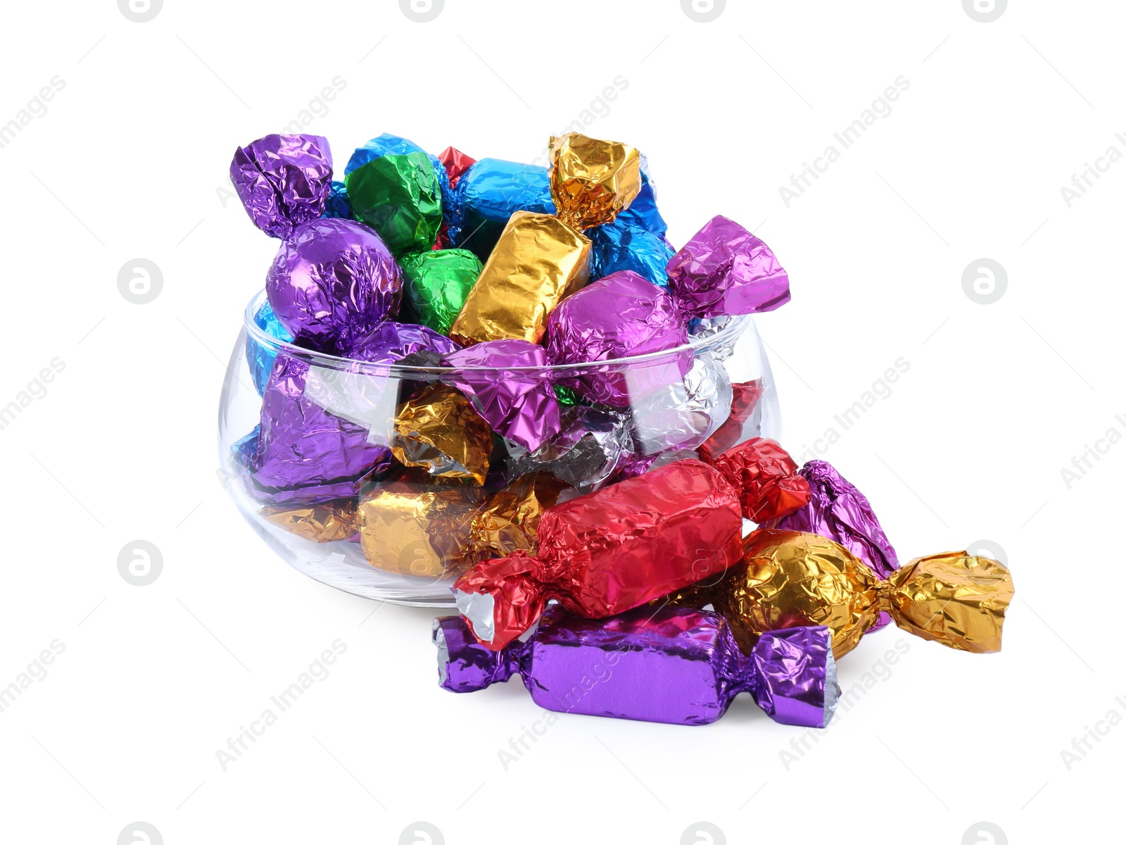 Photo of Bowl with many tasty candies in colorful wrappers on white background