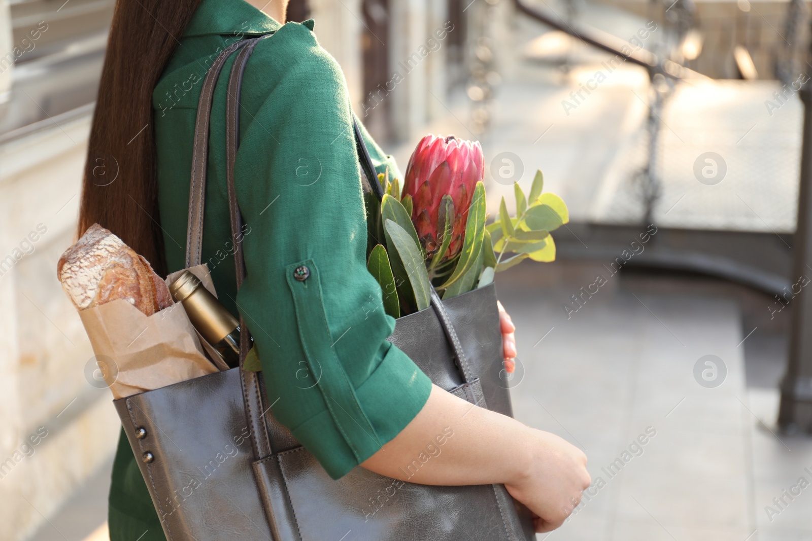 Photo of Woman with leather shopper bag outdoors, closeup