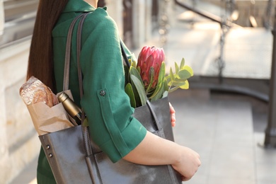 Photo of Woman with leather shopper bag outdoors, closeup