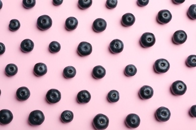 Photo of Fresh acai berries on pink background, flat lay