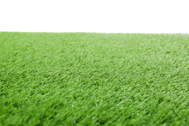 Green artificial grass surface isolated on white