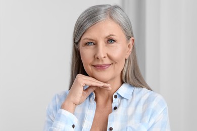 Photo of Portrait of beautiful senior woman with gray hair indoors