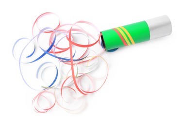 Photo of Colorful streamers with bright party popper isolated on white, above view