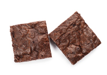 Photo of Pieces of fresh brownie on white background, top view. Delicious chocolate pie