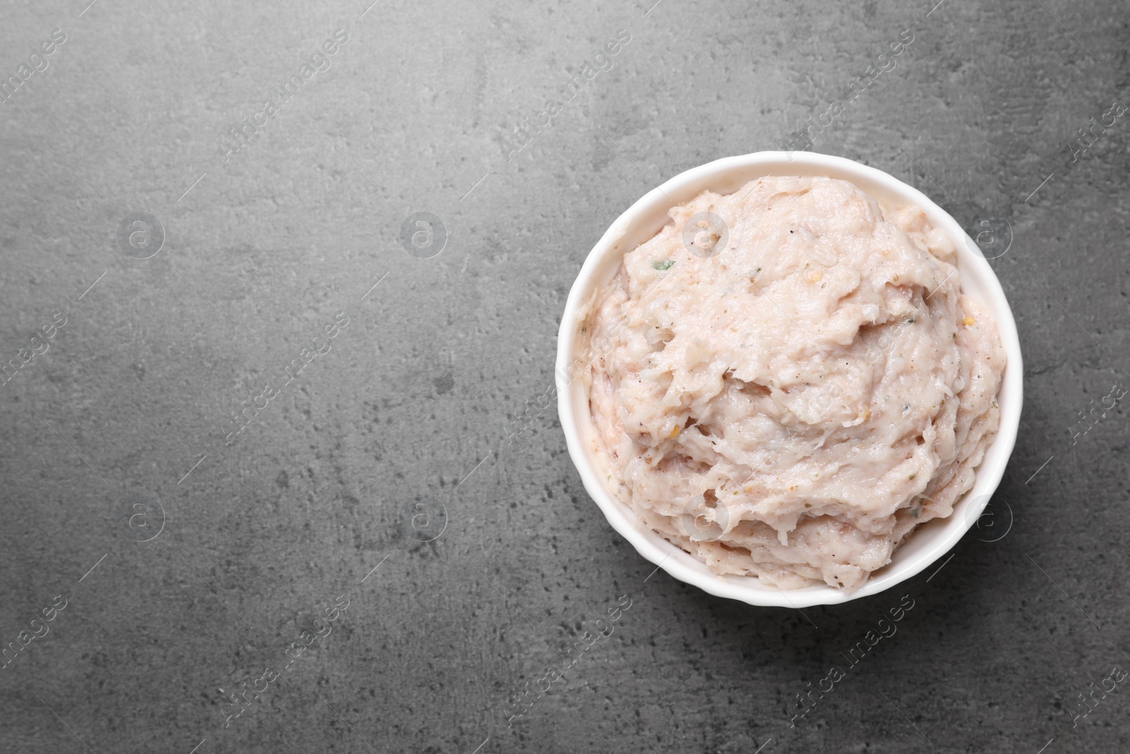 Photo of Delicious lard spread on grey table, top view. Space for text