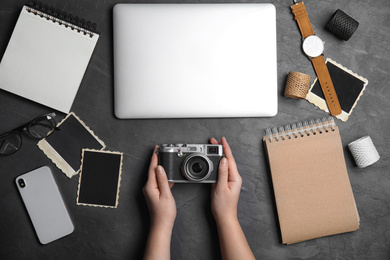 Photo of Professional designer with camera at workplace, top view