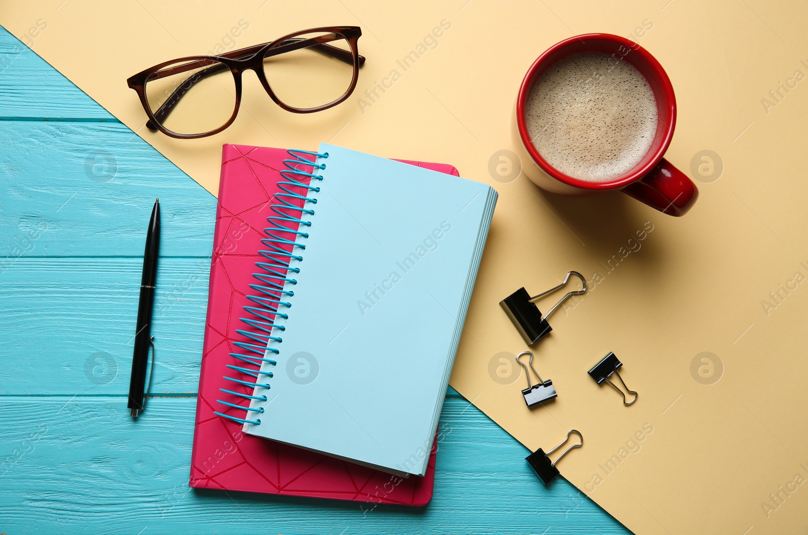 Photo of Flat lay composition with office stationery on wooden and paper background. Space for design