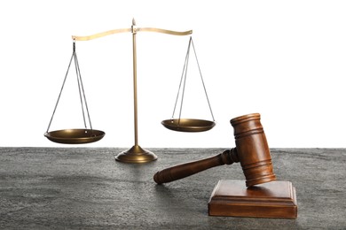 Photo of Law concept. Judge's mallet and scales of justice on dark grey table against white background