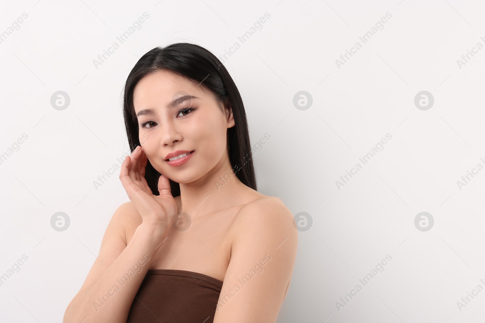 Photo of Portrait of beautiful woman on white background