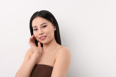 Portrait of beautiful woman on white background